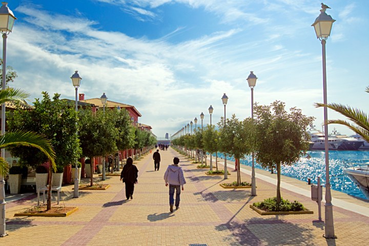 a group of people walking down the street