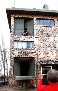 a person sitting in front of a building