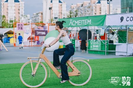 a woman holding a bicycle